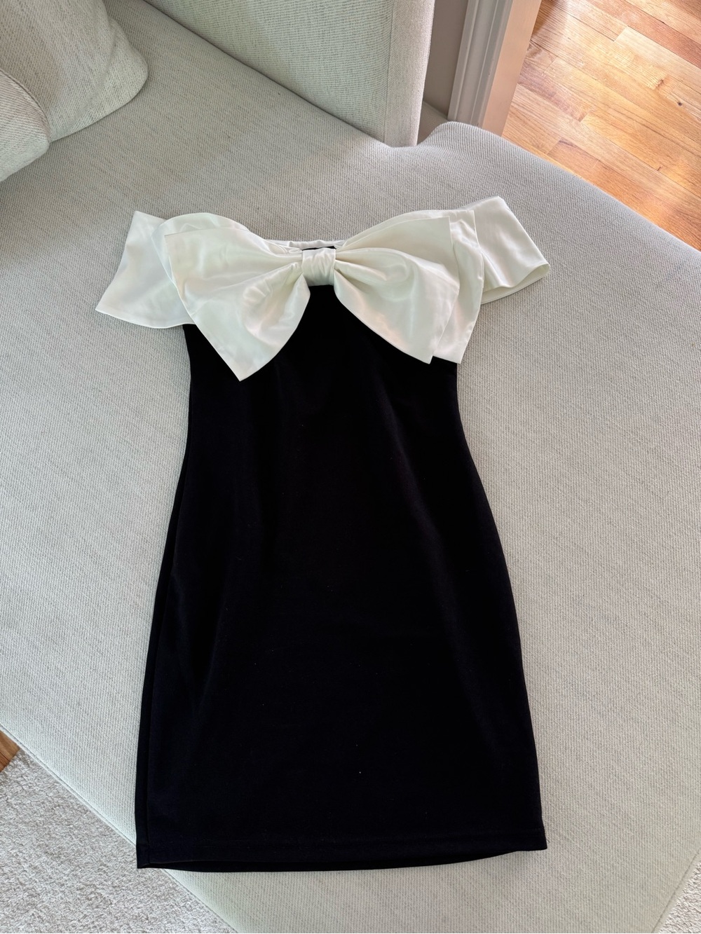 Black Mini Dress with White Bow Off-Shoulder Detail